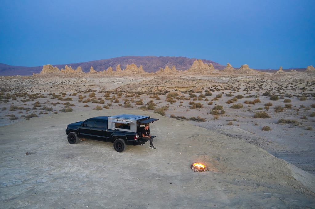 Man Sitting at the Back of a Camper Truck